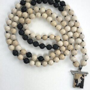 MATTE ONYX, WOOD JASPER AND BLACK LAVA MALA WITH A DALMATIAN JASPER PENDANT